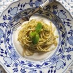 Mint pesto pasta in a bowl with mint leaves.