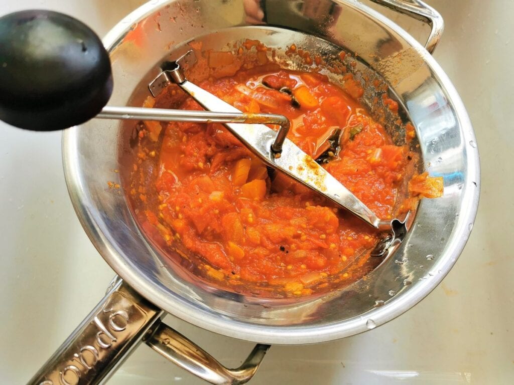 Making Italian tomato sauce using a passavedura food mill.