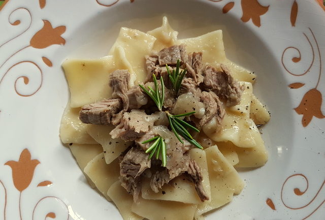 Maltagliati pasta with braised veal and onions 