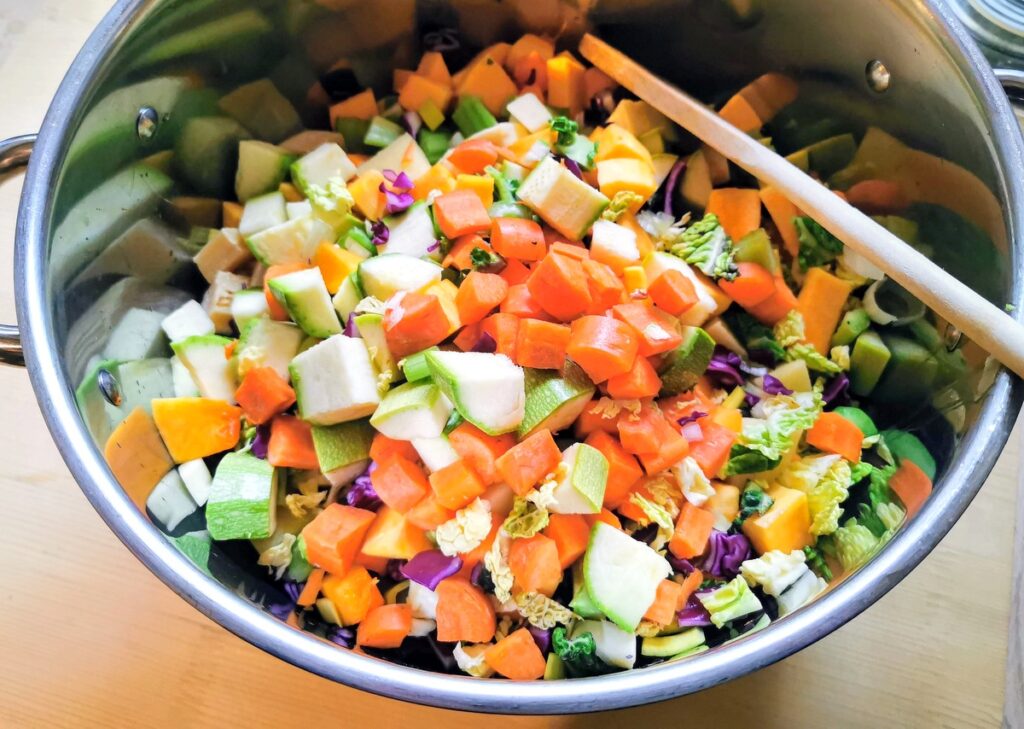 All the prepared minestrone vegetables in large soup pot