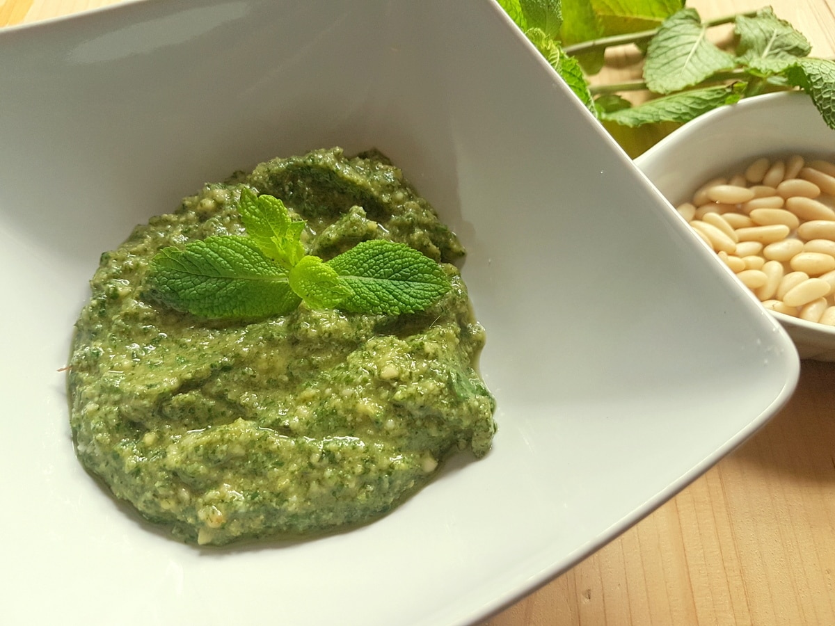 Mint pesto garnished with mint leaves.