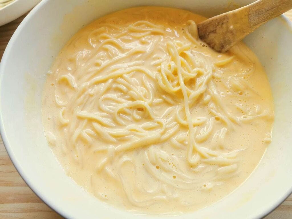 Ricotta and pasta pie filling in white bowl