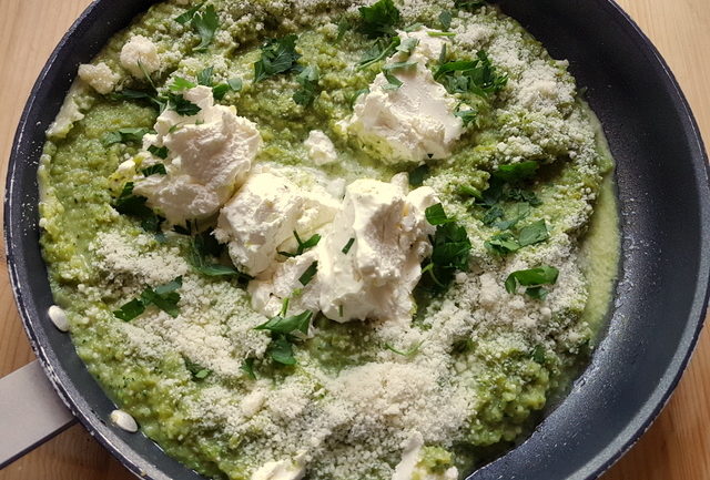 Italian robiola cheese with asparagus sauce in frying pan