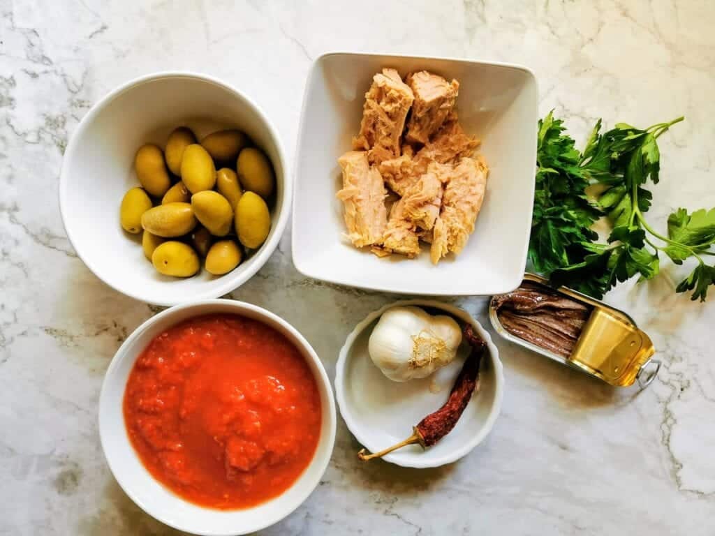 ingredients for all'Ascolana sauce in white bowls