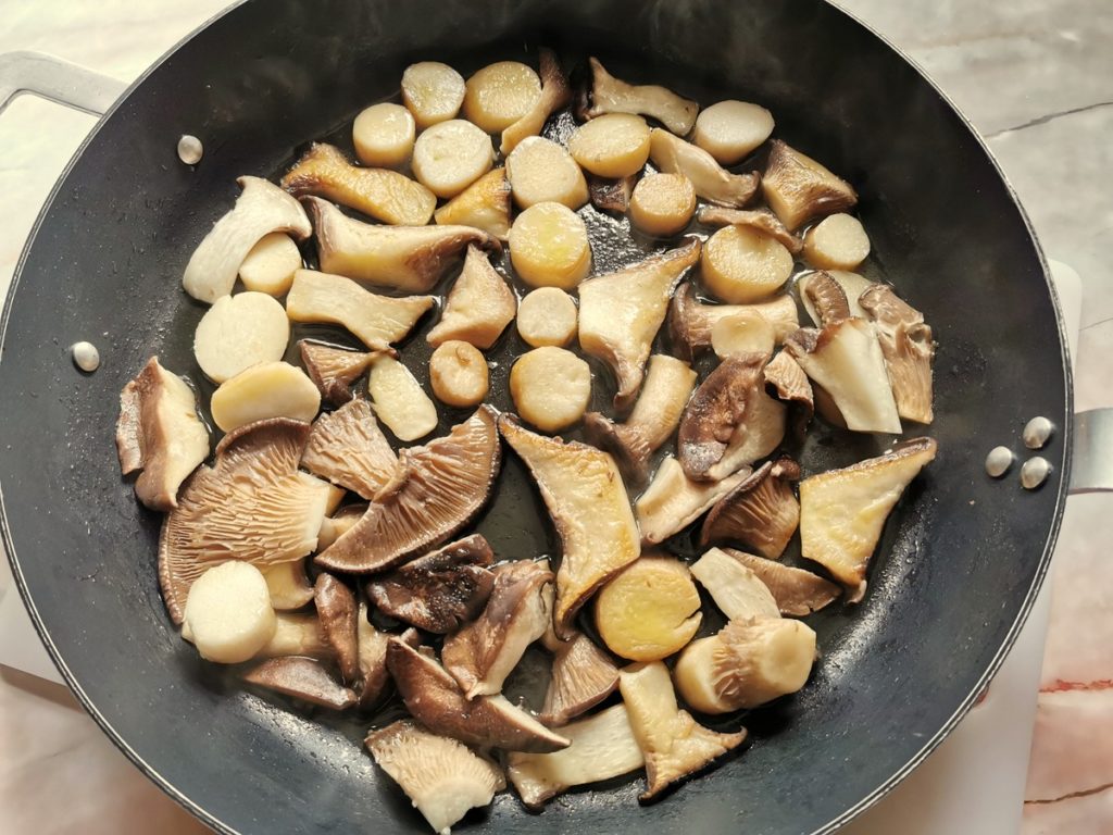 Cut mushrooms in skillet with olive oil