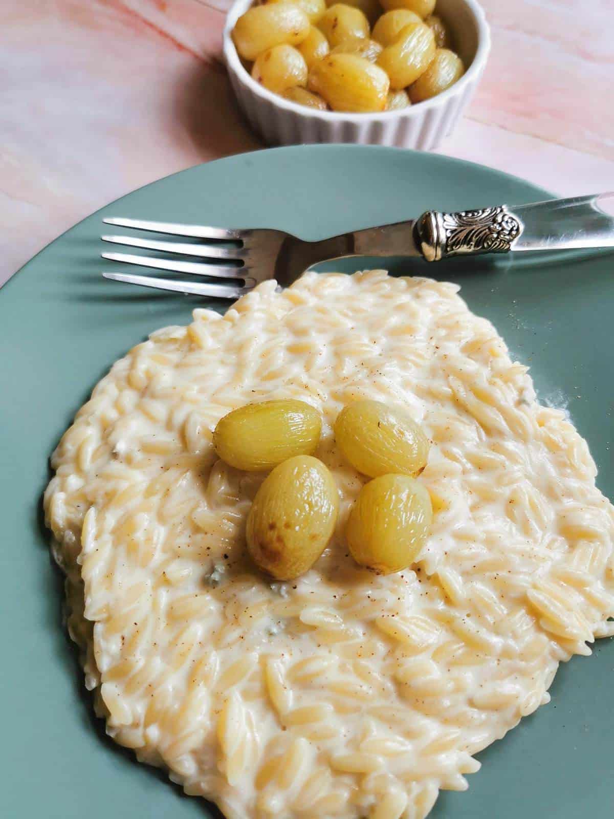 Orzo pasta risotto with roasted grapes.