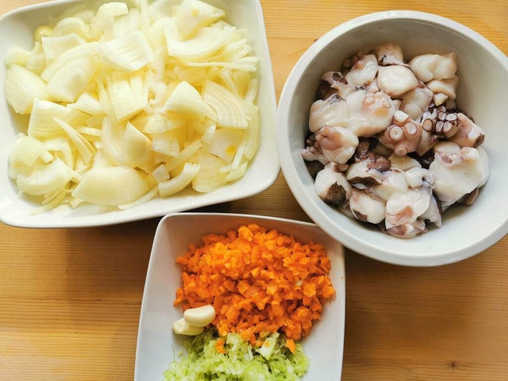 prepared, onions, octopus and vegetable ingredients in white bowls