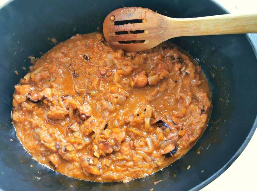 Cooked octopus alla genovese ragu in Dutch oven