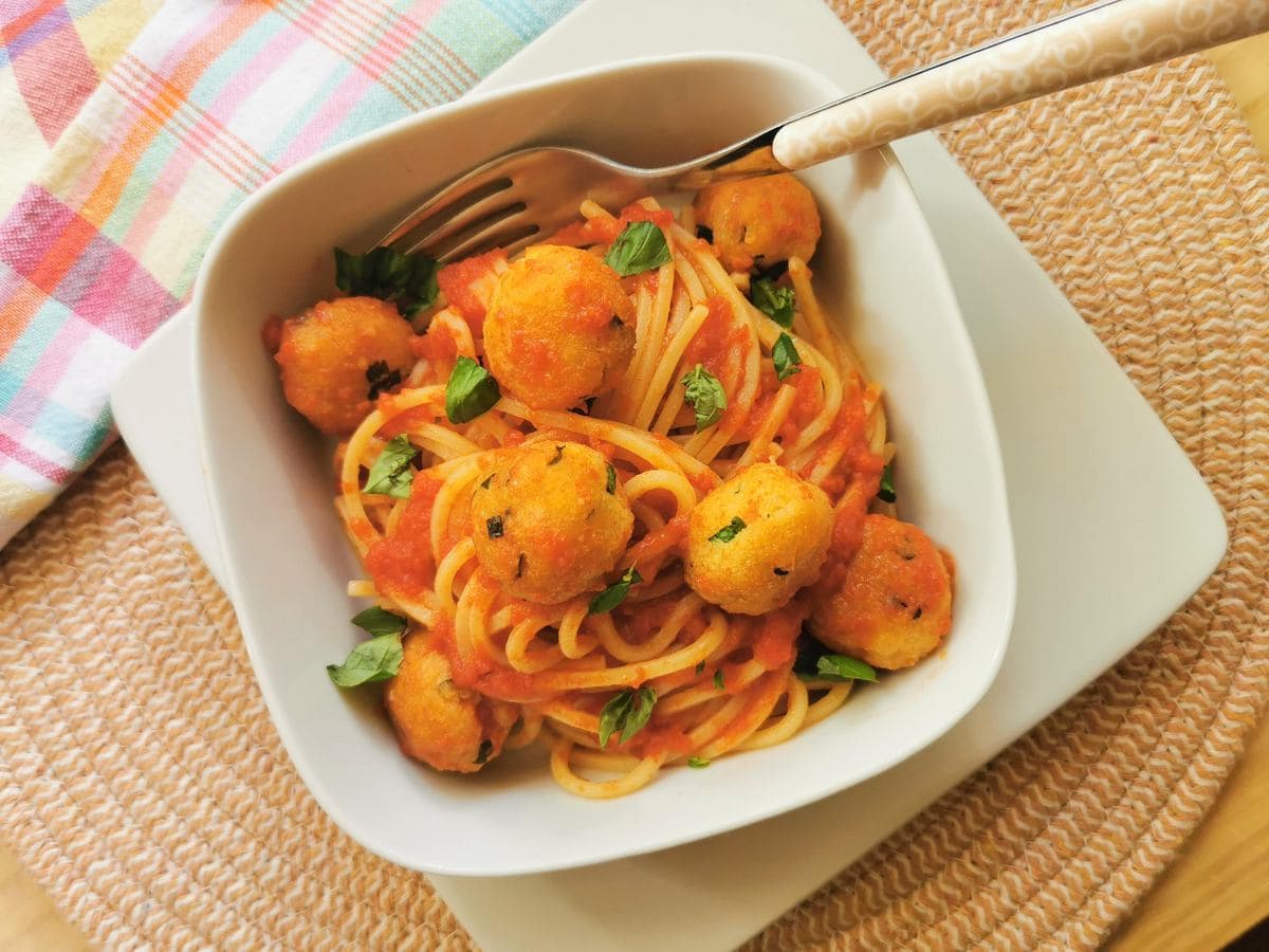 Pallotte cacio e ova cheese and egg balls in tomato sauce with pasta.