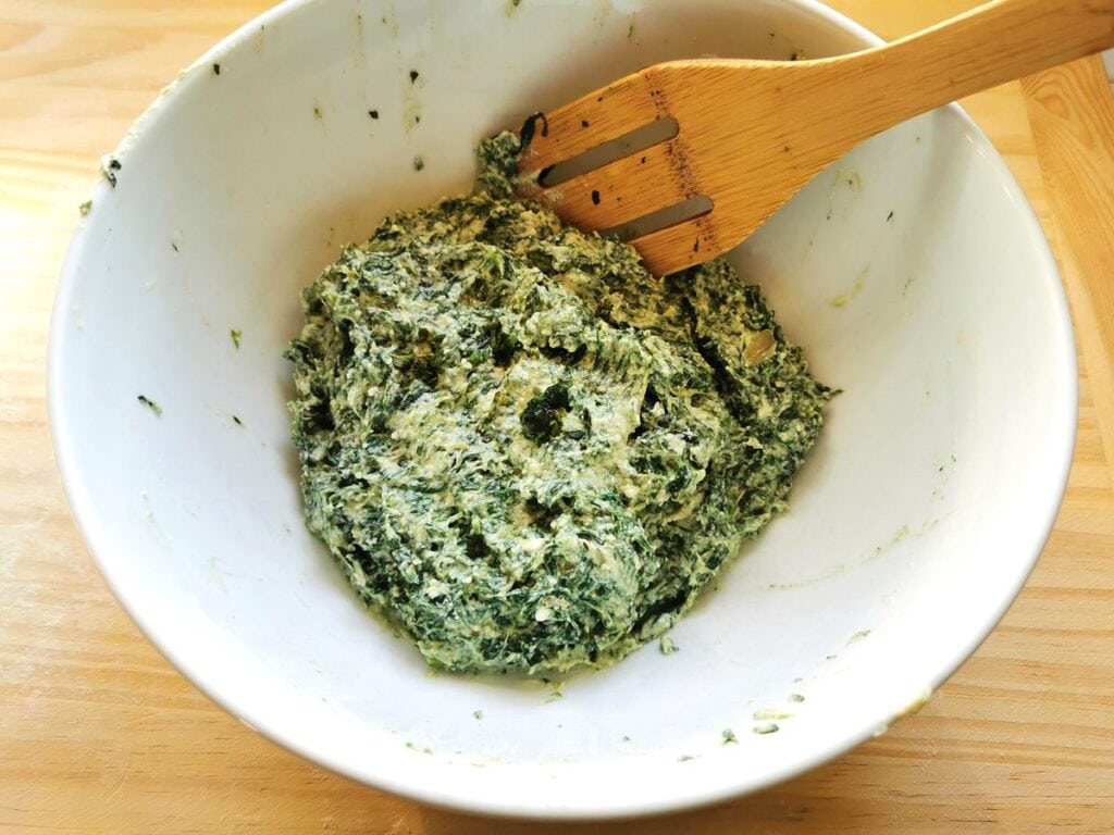 Ready filling for pansotti in white bowl