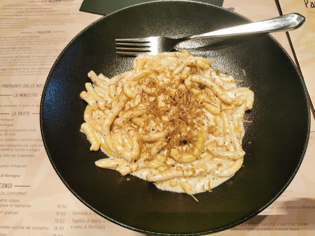 The passatelli with culatello, cheese sauce and truffle in a restaurant in Ravenna.