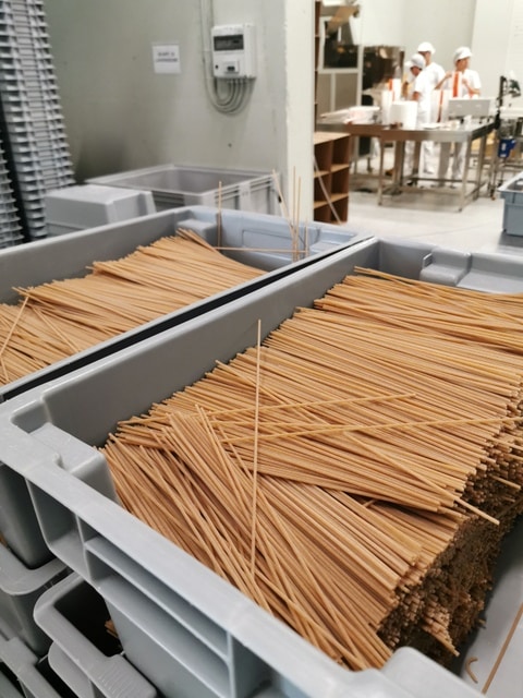 whole wheat pasta cut and ready to be packaged