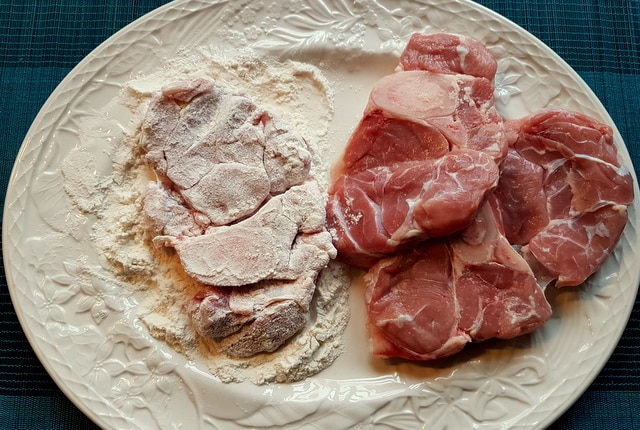 Pasta Ossobuco floured veal cuts on white plate