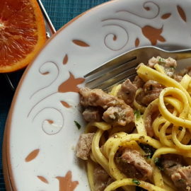 Pasta Ossobuco close up in white and terracotta bowl