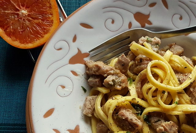 Fettuccine Pasta Ossobuco close up in white and terracotta bowl