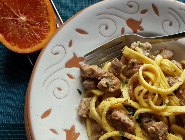 Pasta Ossobuco close up in white and terracotta bowl