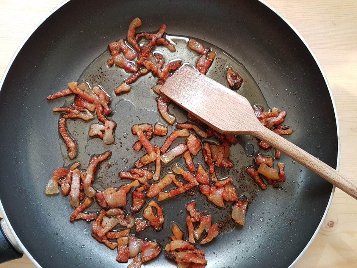 cooked guanciale/pork jowl slices in frying pan