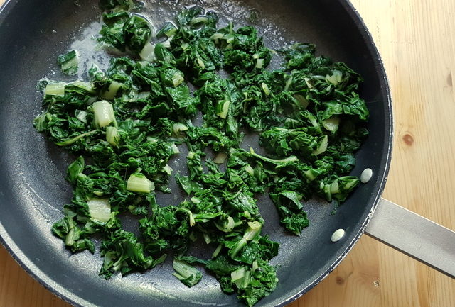 chopped and cooked Swiss chard in frying pan