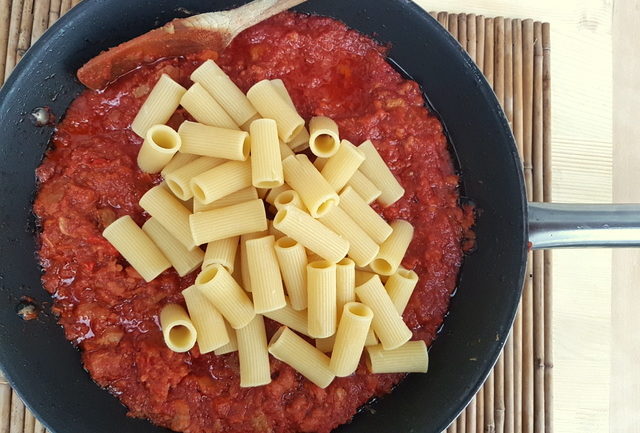 Pasta with Lamb ragu Molisano rigatoni pasta and sauce in frying pan