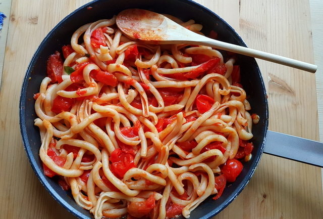 spaccatelle pasta with homemade tomato sauce in frying pan