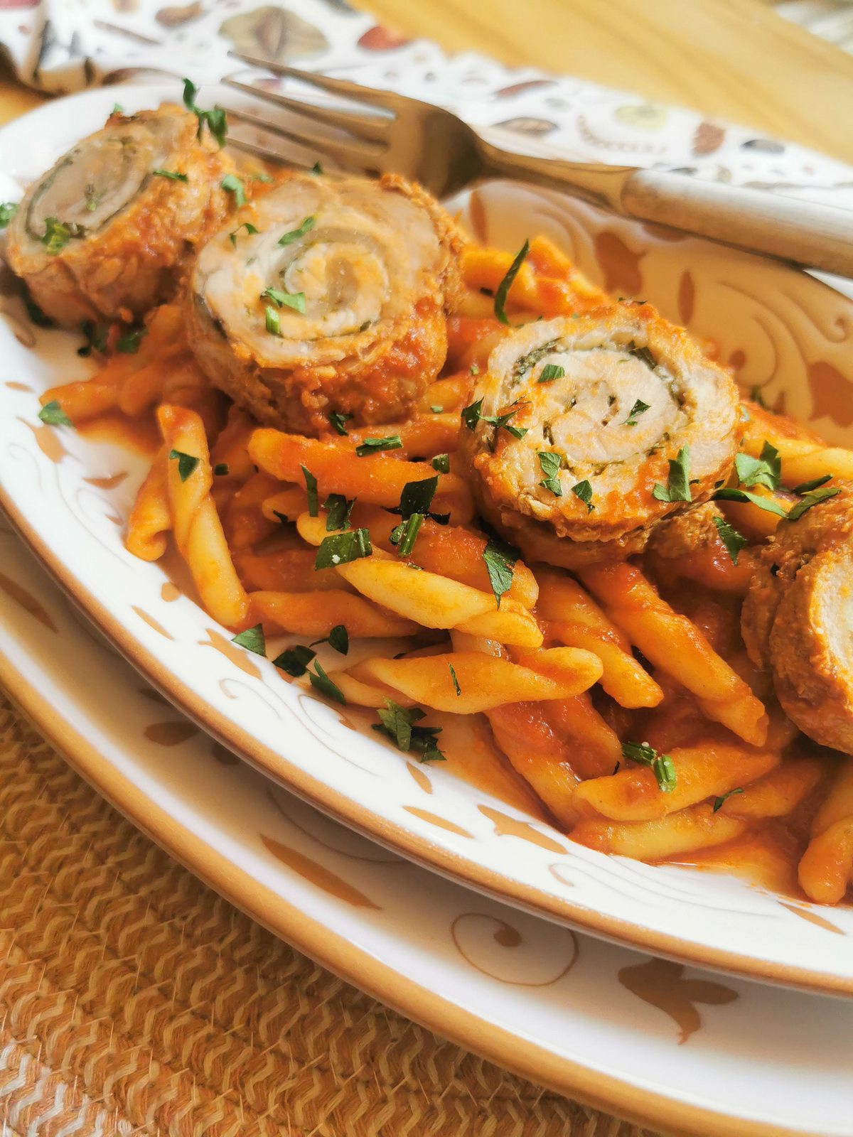 Pasta with pork involtini in tomato sauce alla Lucana.