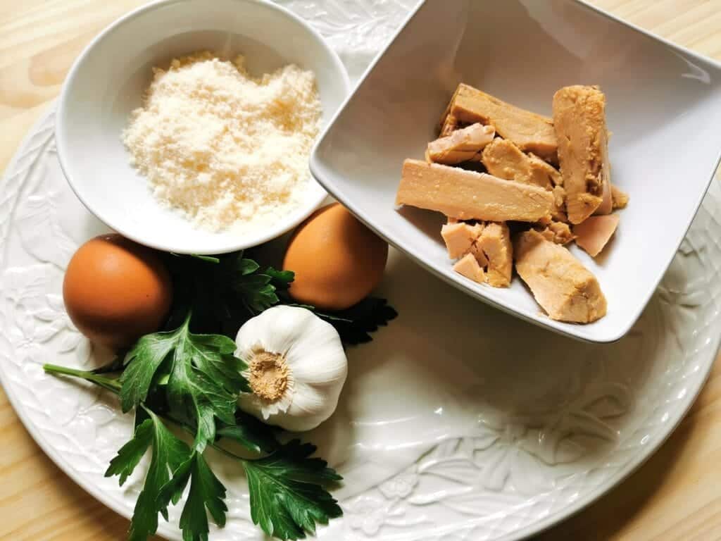 ingredients for tuna carbonara on white plate