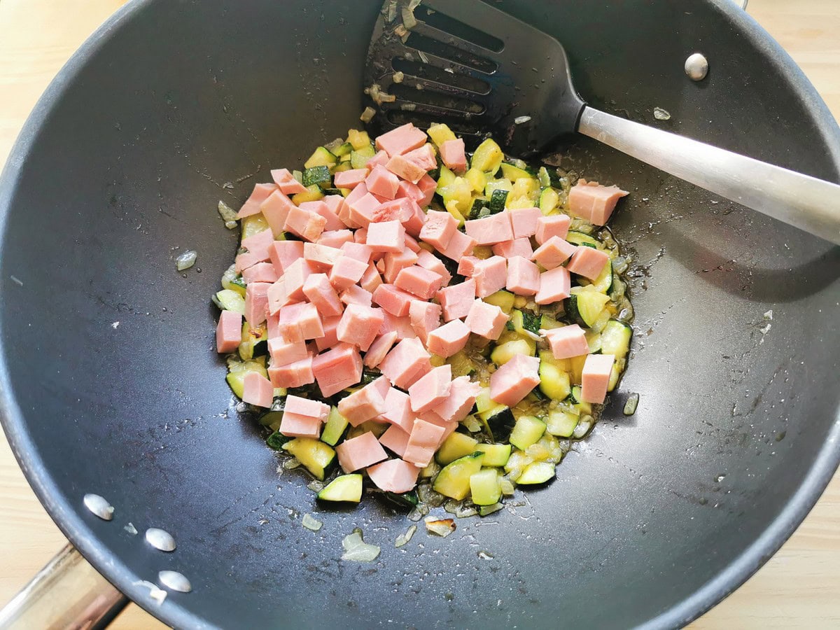 Small cubes of ham added to skillet with onion and zucchini.