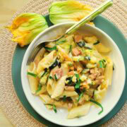Pasta with zucchini flowers, saffron and ham.