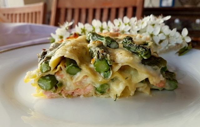 Seafood pasta recipes poached salmon and asparagus lasagne al forno one portion on white plate