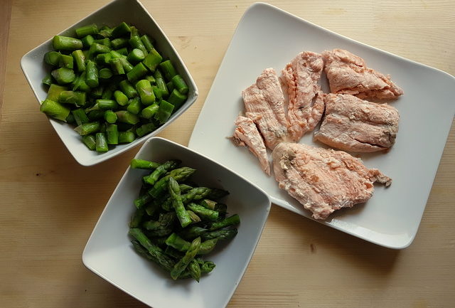 chopped boiled asparagus and poached salmon on white plates ingredients for poached salmon and asparagus lasagne al forno 