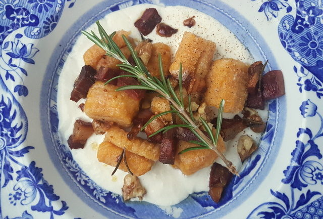 Homemade pumpkin gnocchi with speck and walnuts 