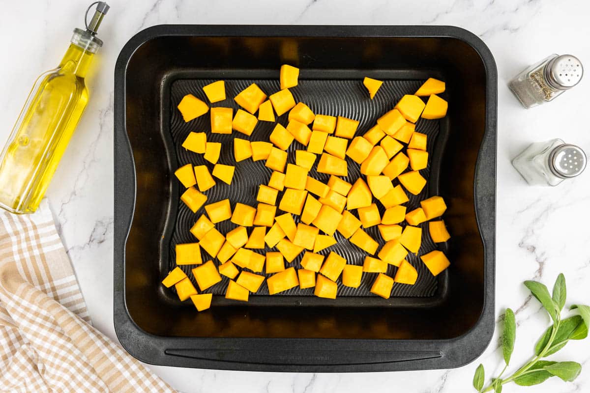 Cubed pumpkin on a baking tray