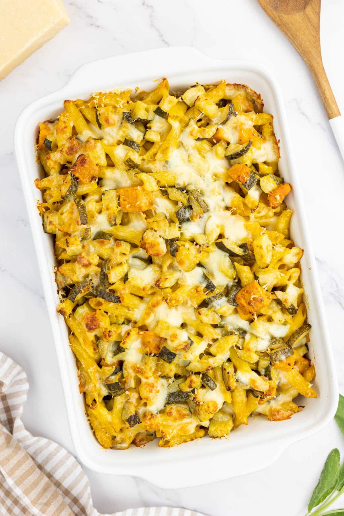 Baked pumpkin pasta in a white baking dish