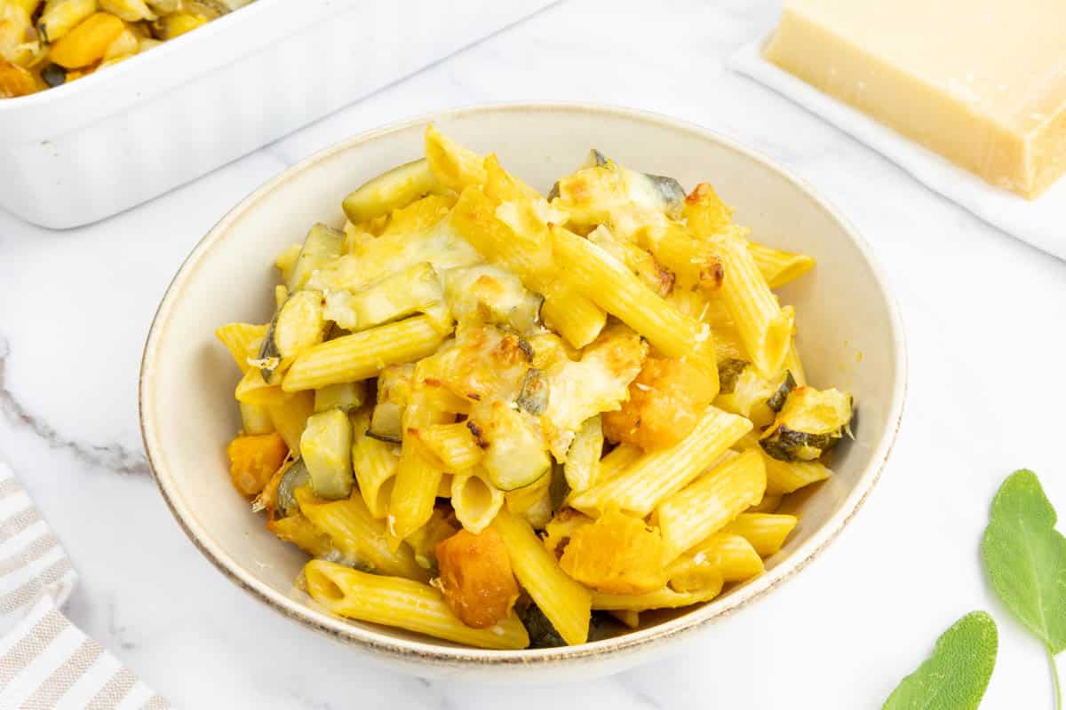 Baked pumpkin pasta served in a bowl.