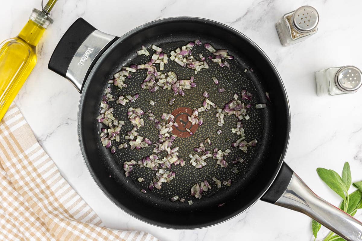 Sauted softened red onions in a large saute pan