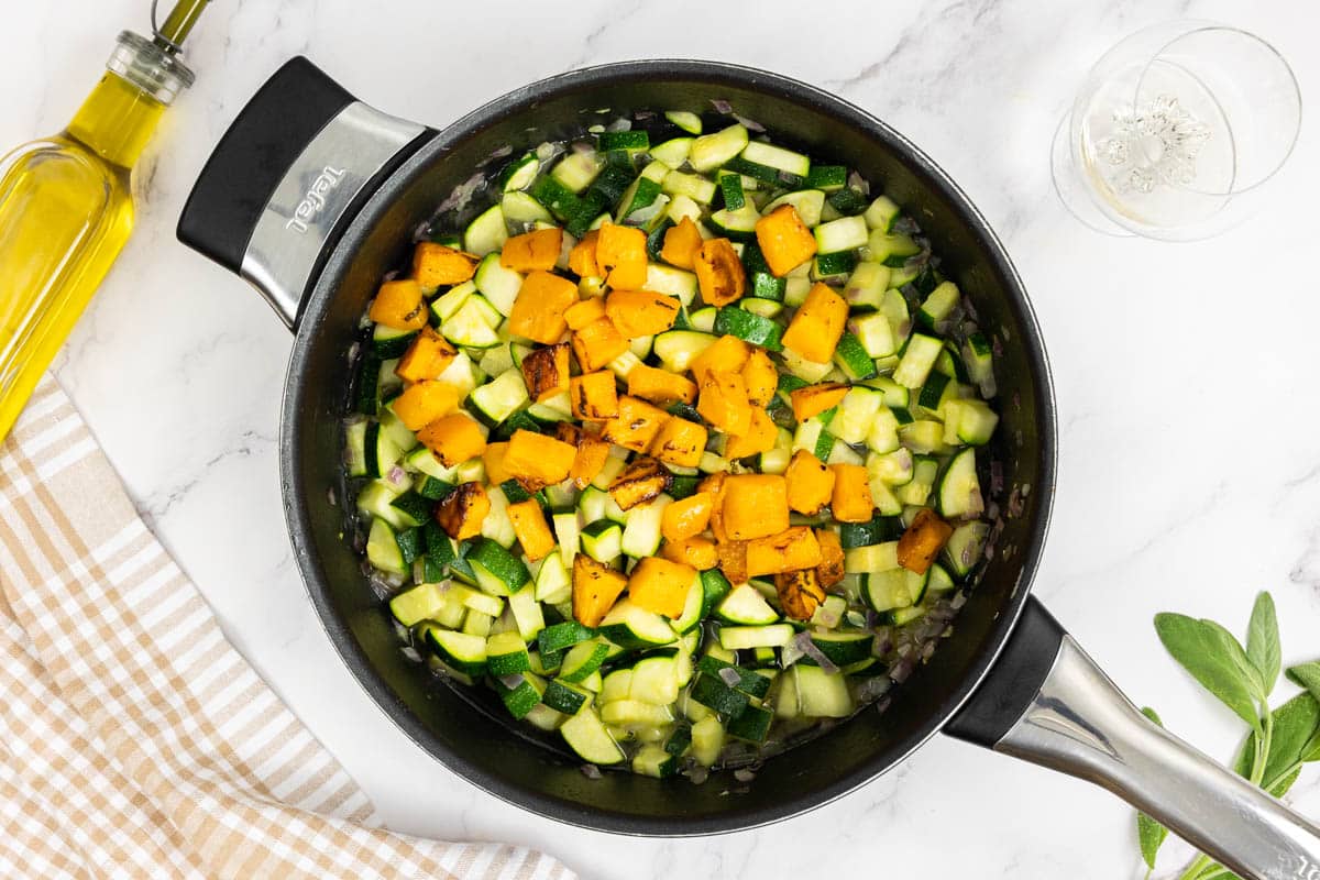 Caramelized baked pumpkin added to the large saute pan