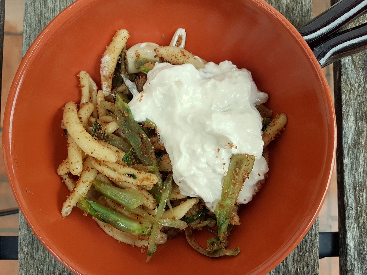 Cavatelli pasta with puntarelle and burrata.