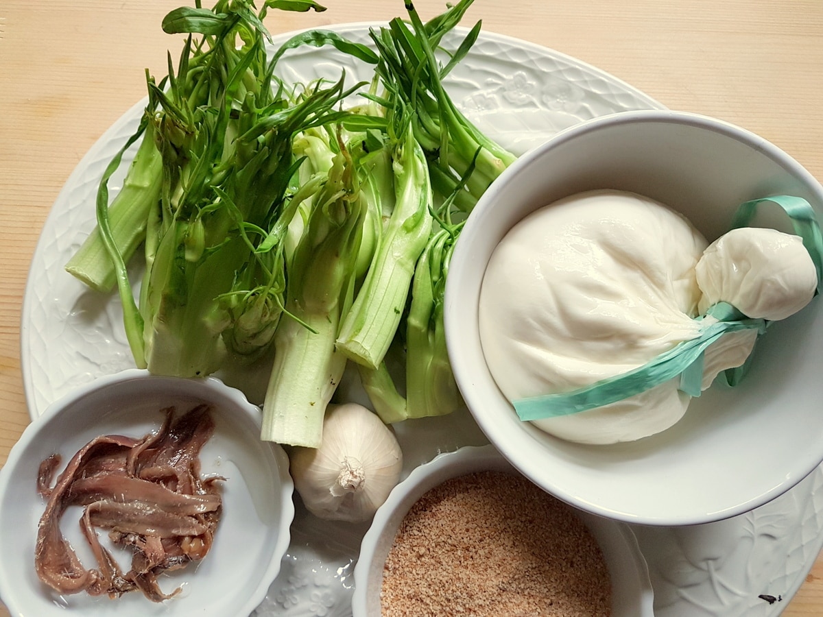 Puntarelle pasta ingredients on a kitchen table.