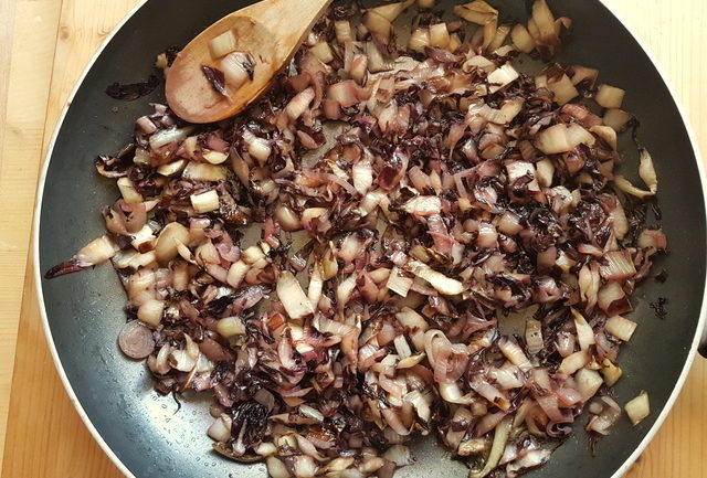 radicchio and shallots cooking in frying pan