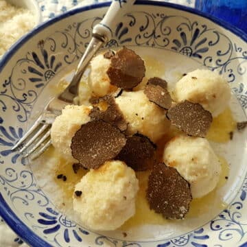 Ricotta gnudi with black truffle