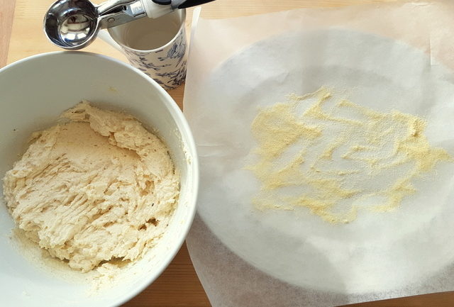 ricotta gnocchi mixture in white bowl with floured baking paper