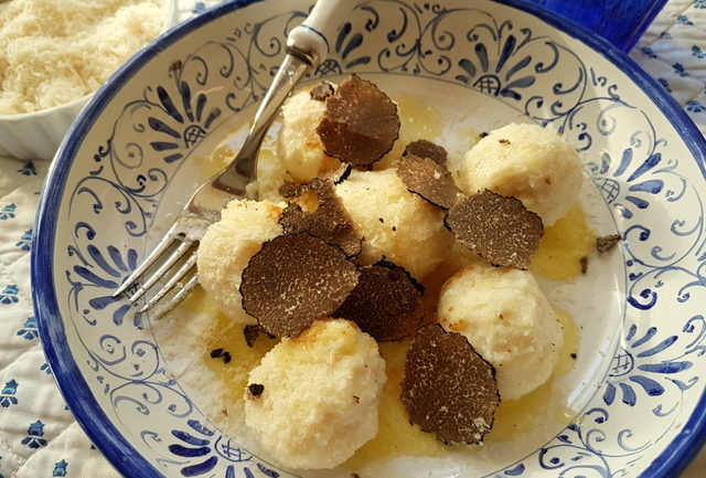 Ricotta gnudi with black truffle