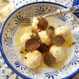 Ricotta gnudi with black truffle