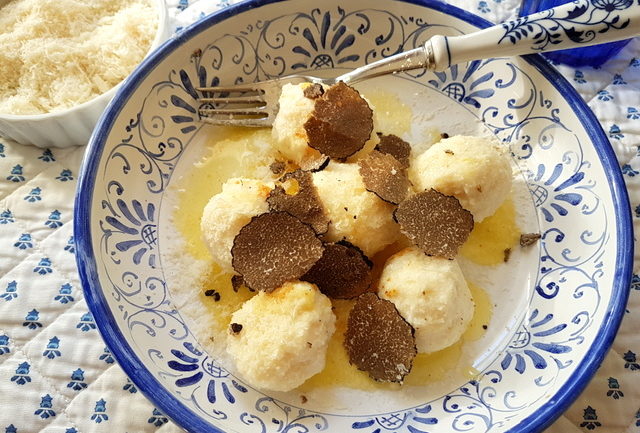 Ricotta gnudi with black truffle