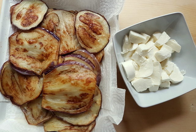 Fried eggplant slices and cubed mozzarella