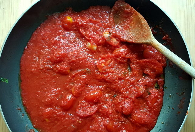 tomato sauce cooking in frying pan