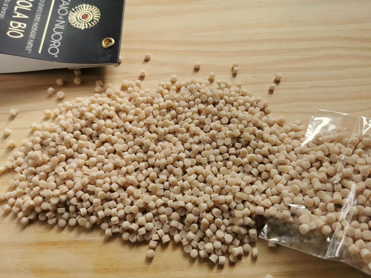 Fregola on a wooden board