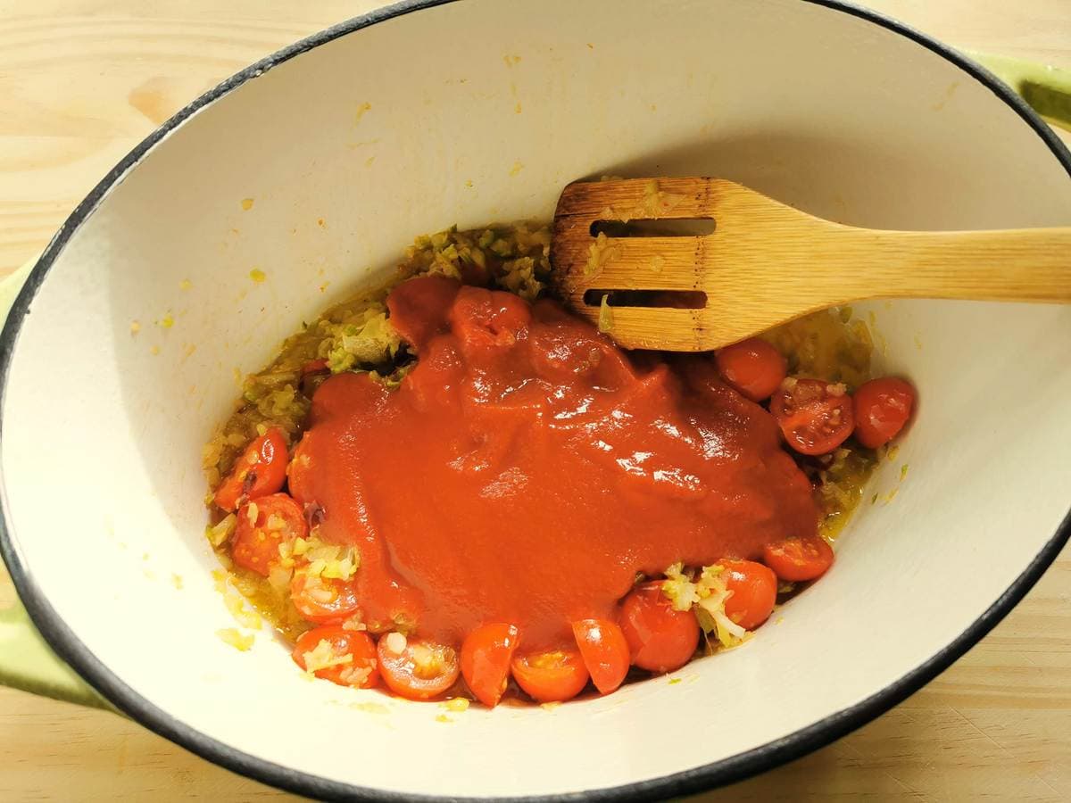 Tomato passata in Dutch oven with other ingredients.