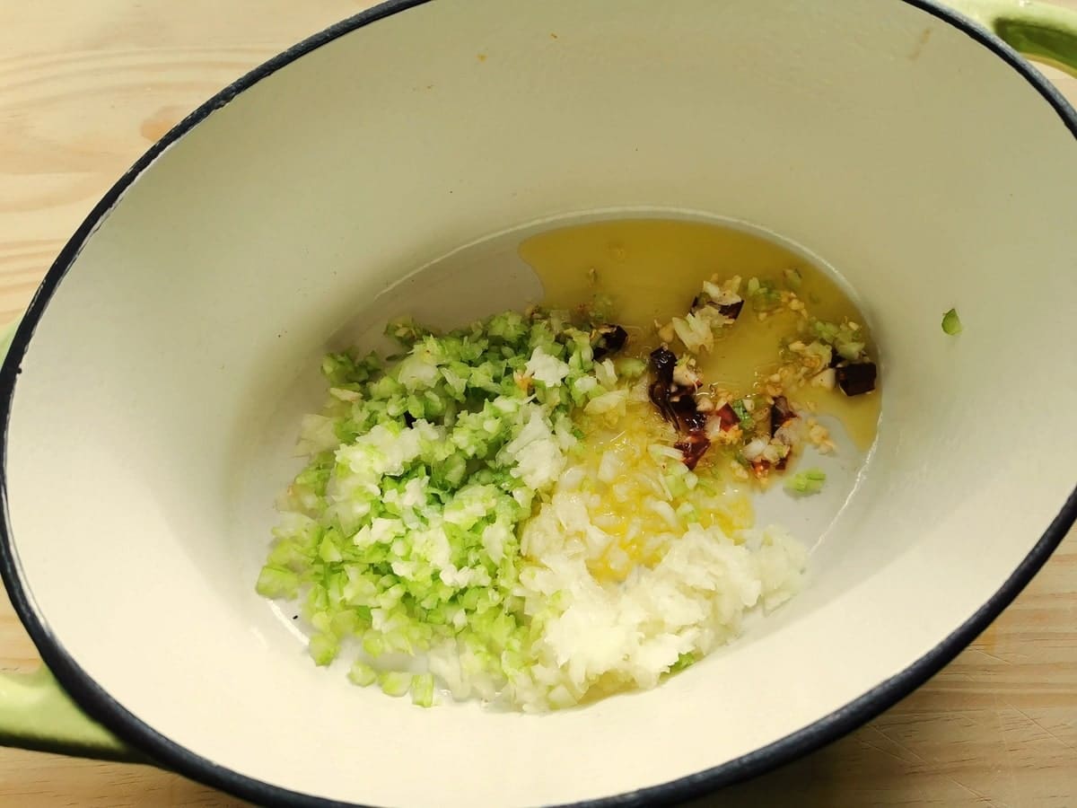 Chopped onion, garlic, celery and peperoncino in olive oil in Dutch oven.