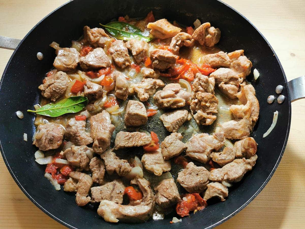 White wine cooking with the lamb and vegetables